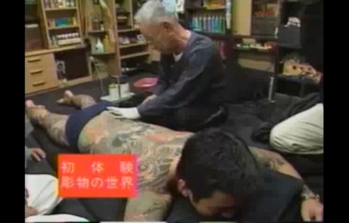 Tattoo artist Choshiro Nakano works on a gang member