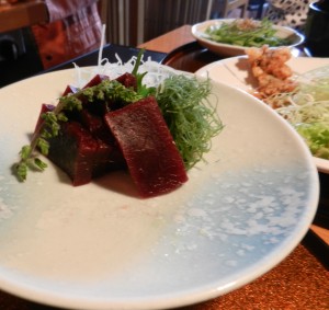 Whale bacon, whale sashimi (raw whale) and whale tempura at Japanese restaurant